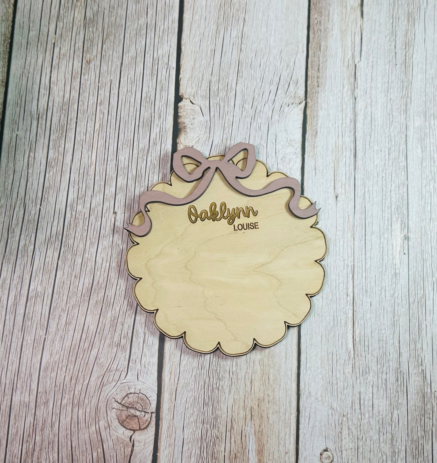 Scalloped round with coquette bow birth stat announcement