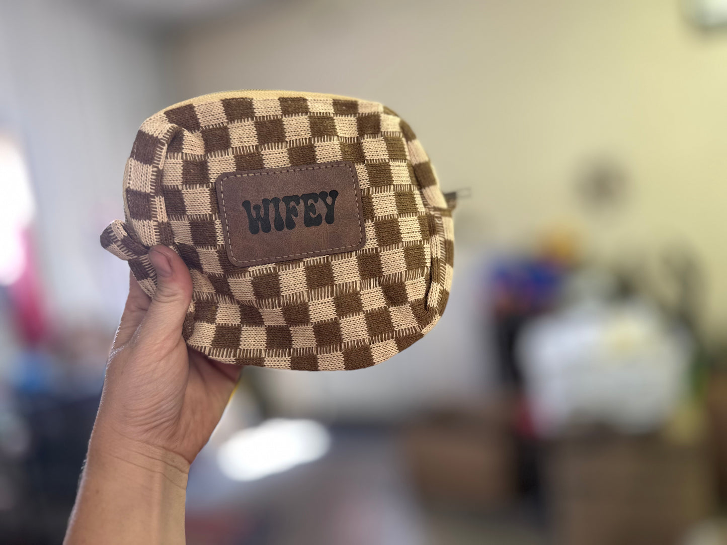 Checkered print bag with custom leather patch