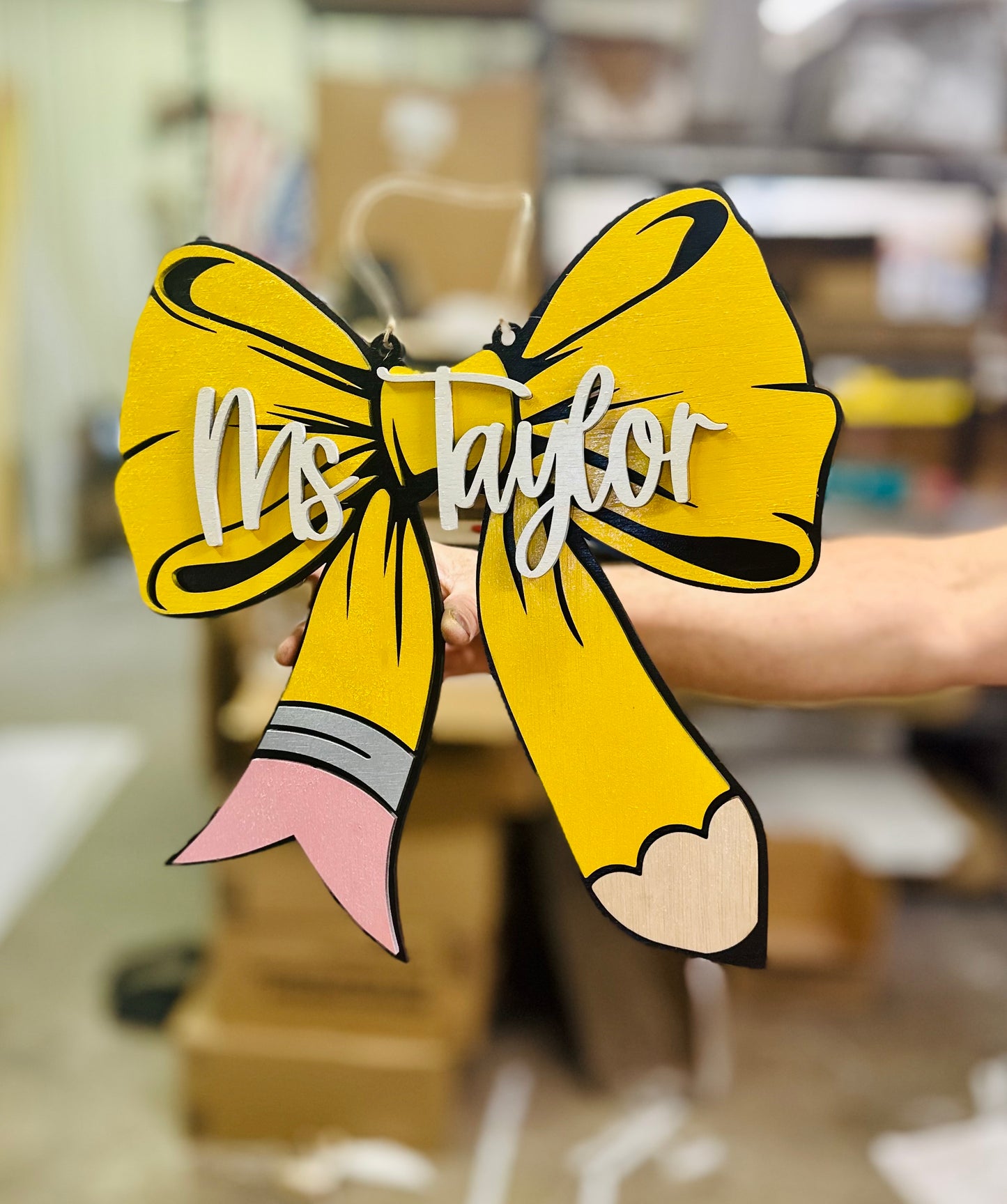 Pencil bow door hanger