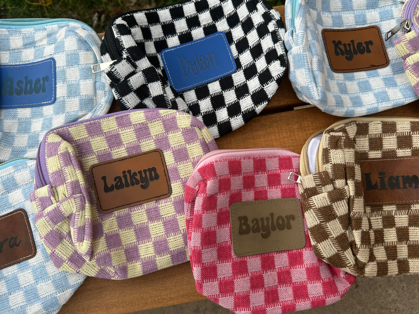 Checkered print bag with custom leather patch