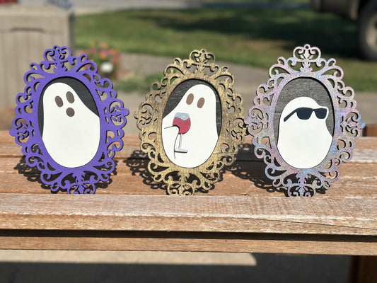 Spooky ghost silhouettes with decorative frames