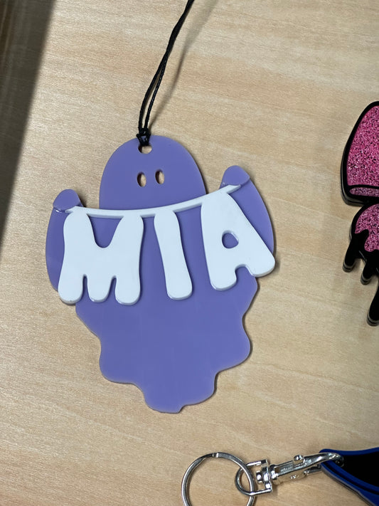 Ghost holding name banner tag