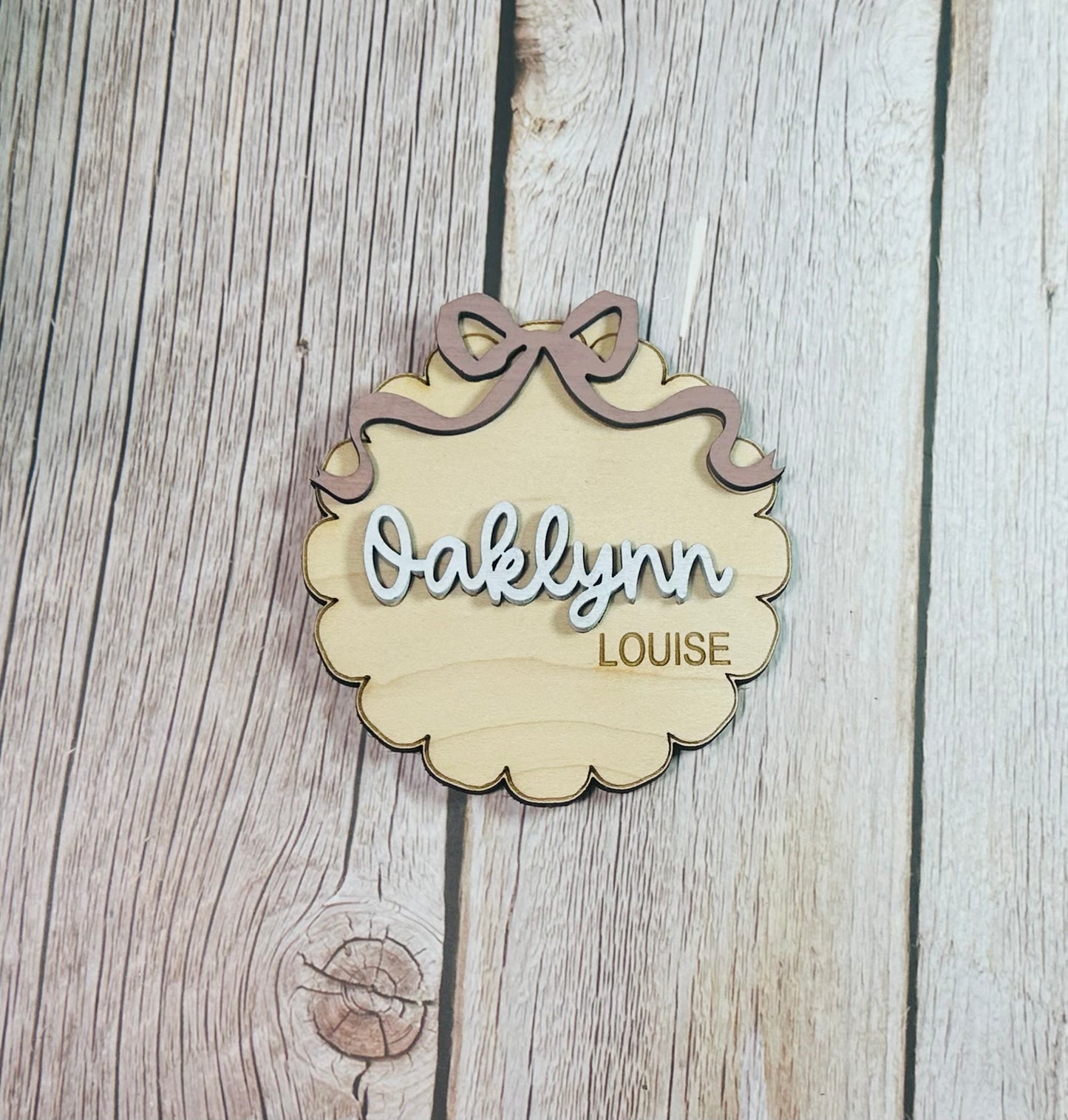 Scalloped round with coquette bow birth stat announcement