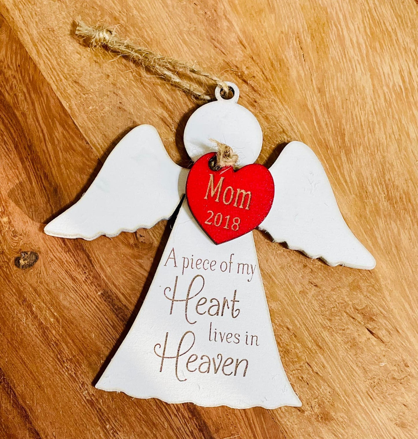 Angel with red heart ornament