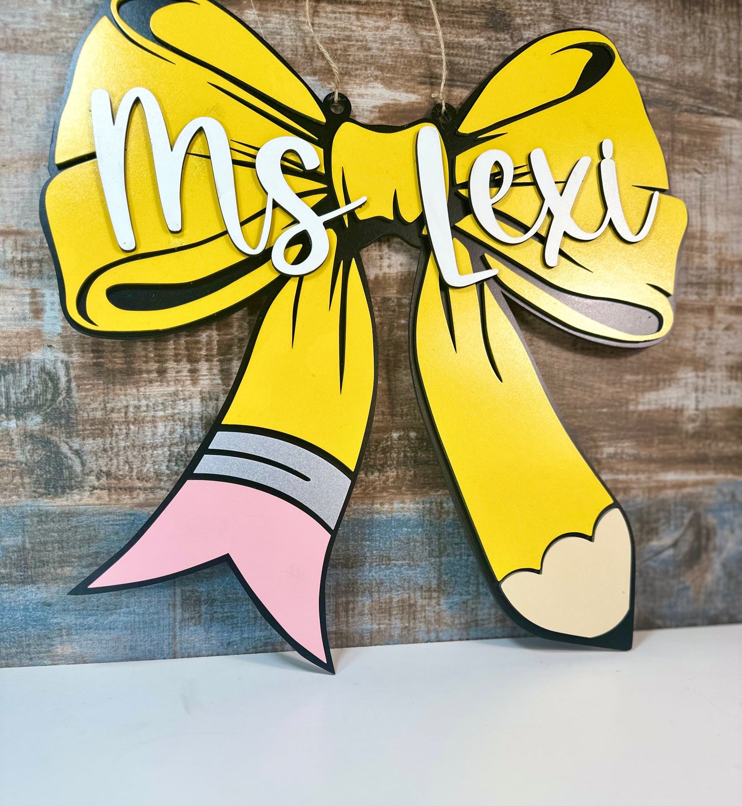 Pencil bow door hanger